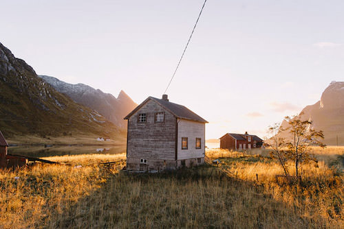 Monday Design Inspiration The Image shows a house in a beautiful valley at sunset